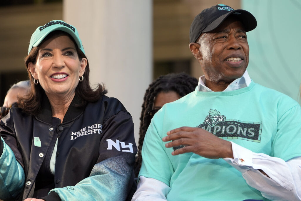 FILE — New York mayor Eric Adams, right, and New York governor Kathy Hochul attend a ceremony in honor of the New York Liberty's WNBA championship at City Hall in New York, Oct. 24, 2024. (AP Photo/Seth Wenig, File)