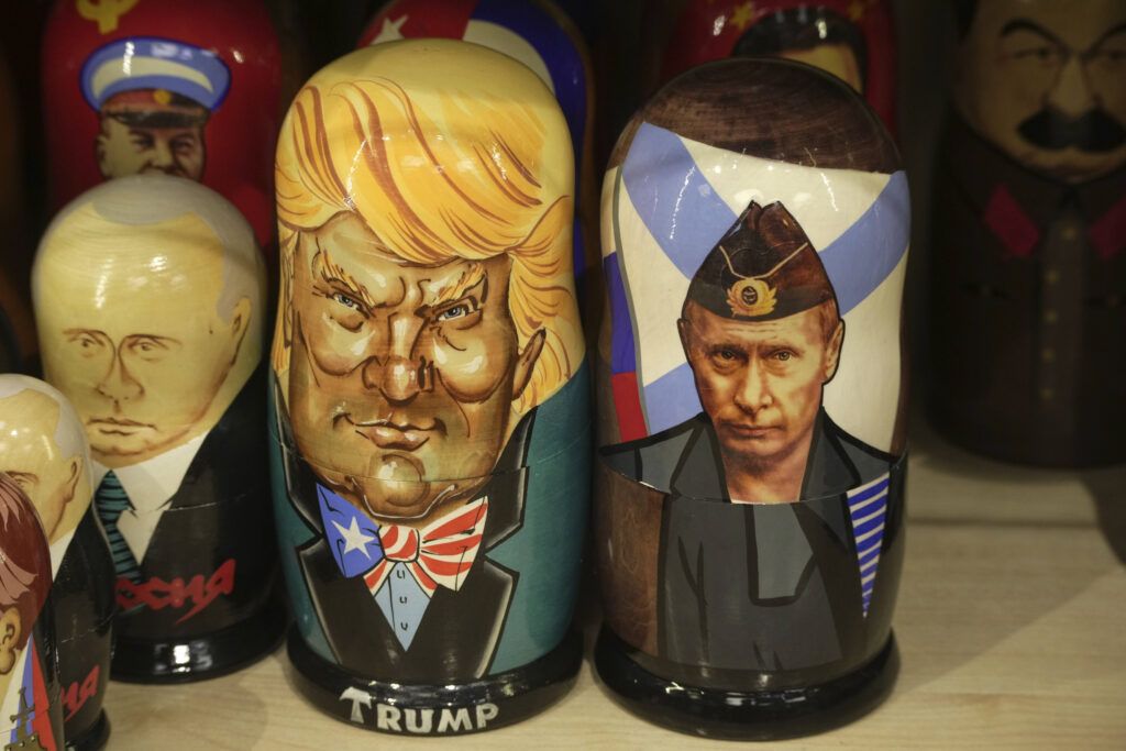 Traditional Russian wooden dolls called Matryoshka depicting Russian President Vladimir Putin, right, and US President Donald Trump are displayed for sale among others at a souvenir shop in St. Petersburg, Russia, Tuesday, March 18, 2025. (AP Photo/Dmitri Lovetsky)