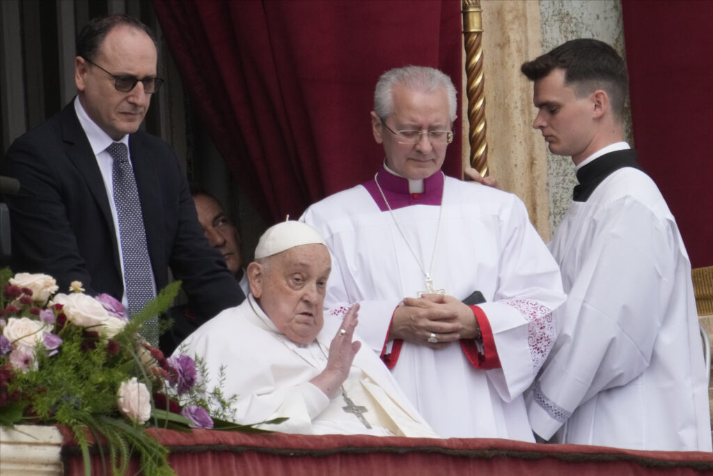 Pope Francis appears on the central lodge of St. Peter's Basilica to bestow the Urbi et Orbi (Latin for to the city and to the world) blessing at the end of the Easter mass presided over by Cardinal Angelo Comastri in St. Peter's Square at the Vatican Sunday, April 20, 2025.