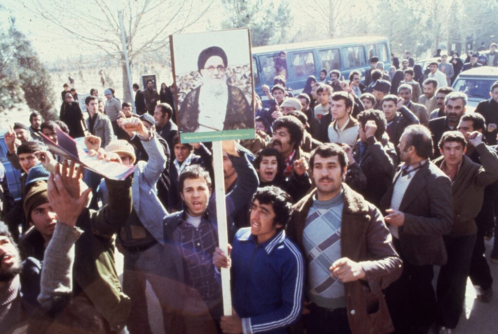 1979: Demonstrators in Teheran calling for the replacement of the Shah of Iran during the Iranian Revolution. They carry placards depicting Ayatollah Mahmoud Talaghani, one of Iran's most militant religious leaders.