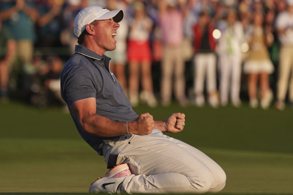 Rory McIlroy, of Northern Ireland, celebrates winning in a playoff against Justin Rose, of England, after the final round the Masters golf tournament, Sunday, April 13, 2025, in Augusta, Ga. (AP Photo/Matt Slocum)