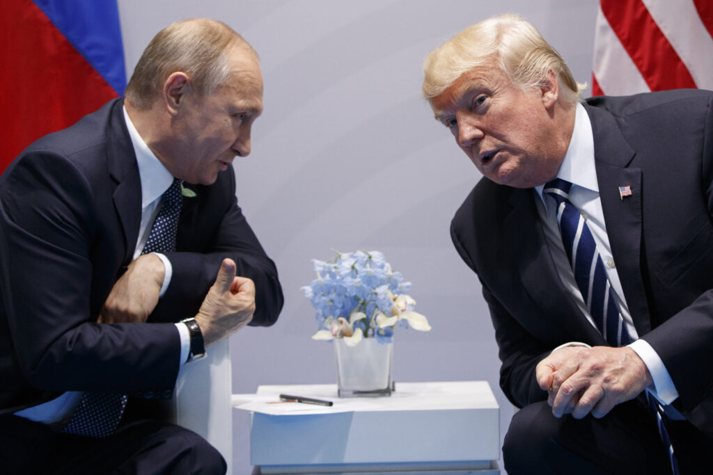 FILE - President Donald Trump, right, meets with Russian President Vladimir Putin at the G-20 Summit in Hamburg, July 7, 2017.