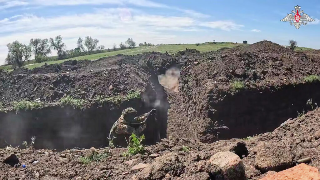 In this photo taken from video distributed by Russian Defense Ministry Press Service on Monday, May 12, 2025, Russian servicemen attend a combat training for assault units in an undisclosed location in Ukraine.