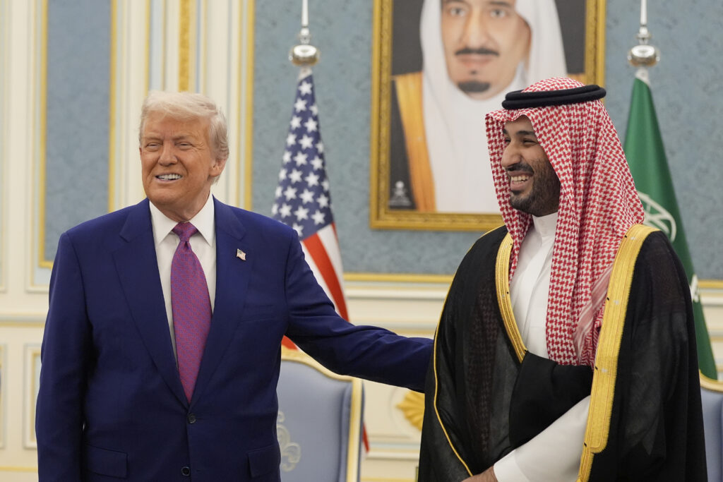 President Donald Trump and Saudi Crown Prince Mohammed bin Salman gesture as they meet delegations at the Royal Palace in Riyadh, Saudi Arabia, Tuesday, May 13, 2025.