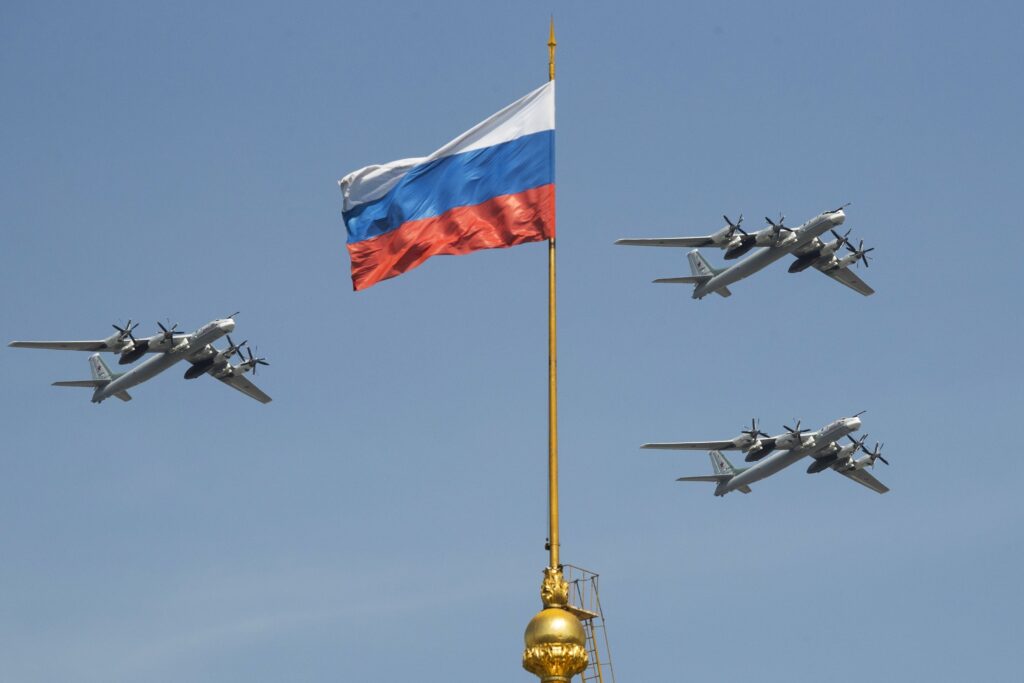 Russian Tu-95 strategic bombers fly over the Kremlin during a rehearsal for the Victory Day military parade at Moscow.