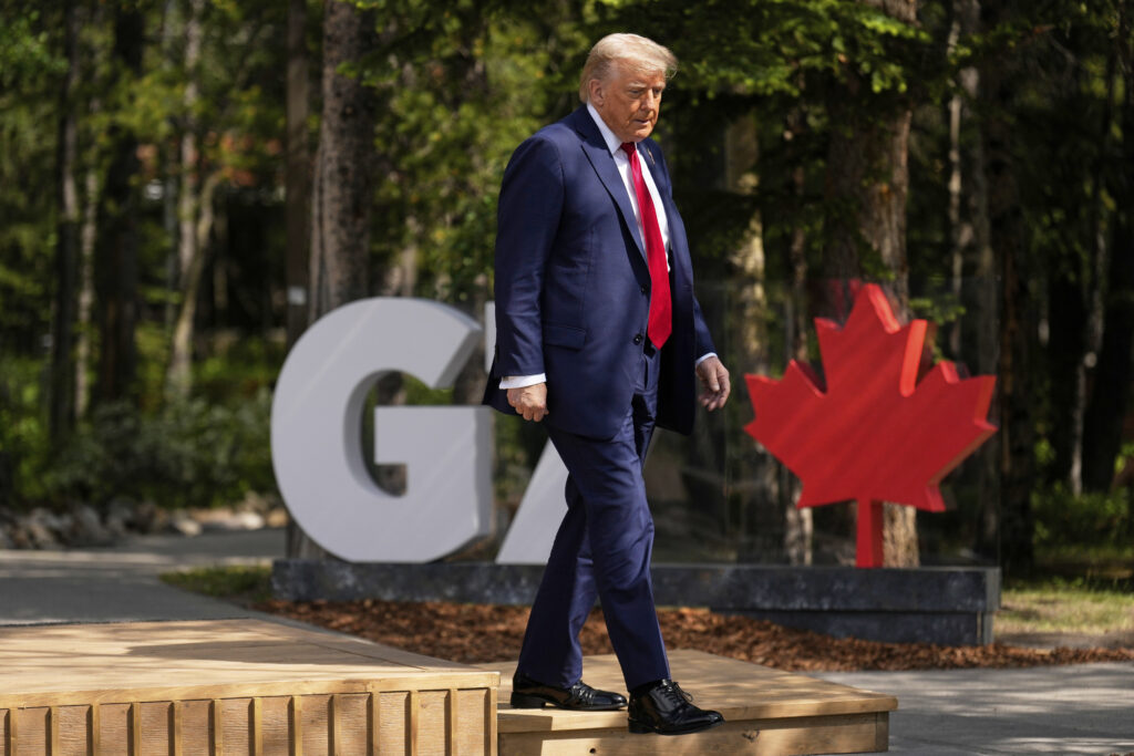 President Donald Trump walks during the official welcome of the G7 Summit, Monday, June 16, 2025, in Kananaskis, Canada.