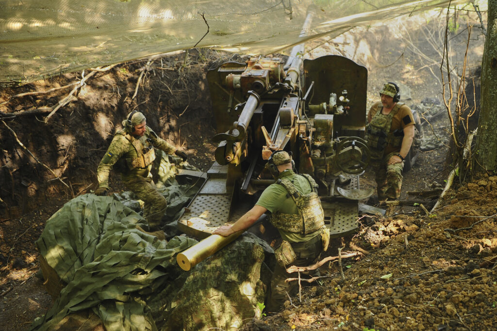 In this photo provided by Ukraine's 127th Separate Brigade of the Territorial Defence press service, soldiers fire a canon towards Russian army positions near Kharkiv, Ukraine, Monday, June 2, 2025,