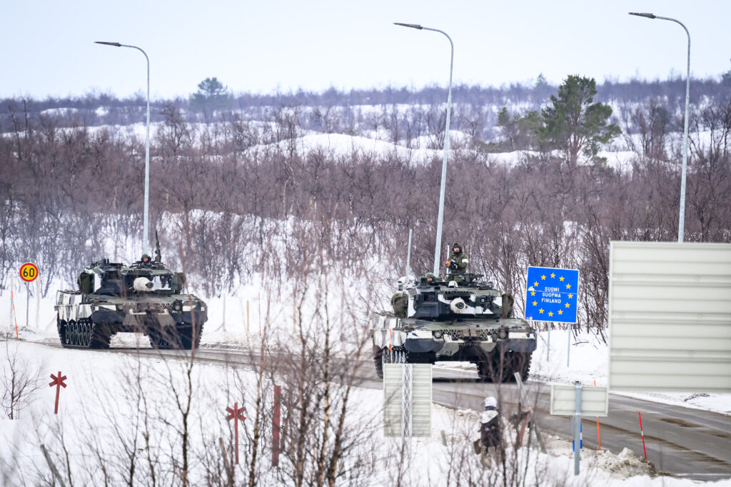 KIVILOMPOLO, FINLAND - MARCH 09: Members of the Finnish Army drive Leopard tanks in an exchange of fire with "enemy troops" during a training exercise, visible to the media, on the Finland/Norway border during the Nordic Response military exercise on March 09, 2024 in Kivilompolo, Finland. The exercise, which primarily takes place across Scandinavia from March 3-14, features 20,000 troops from 13 allied countries. Following the recent NATO expansion, the group now includes Finland and Sweden. (Photo by