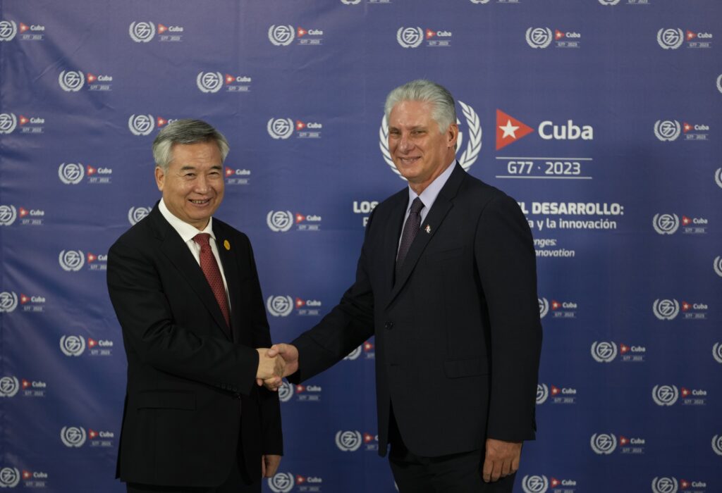 Cuban President Miguel Diaz-Canel, right, shakes hands with Li Xi, member of the Standing Committee of the Political Bureau of the Communist Party of China, during a photo opportunity at the G77+China summit in Havana, Cuba, Friday, Sept. 15, 2023.