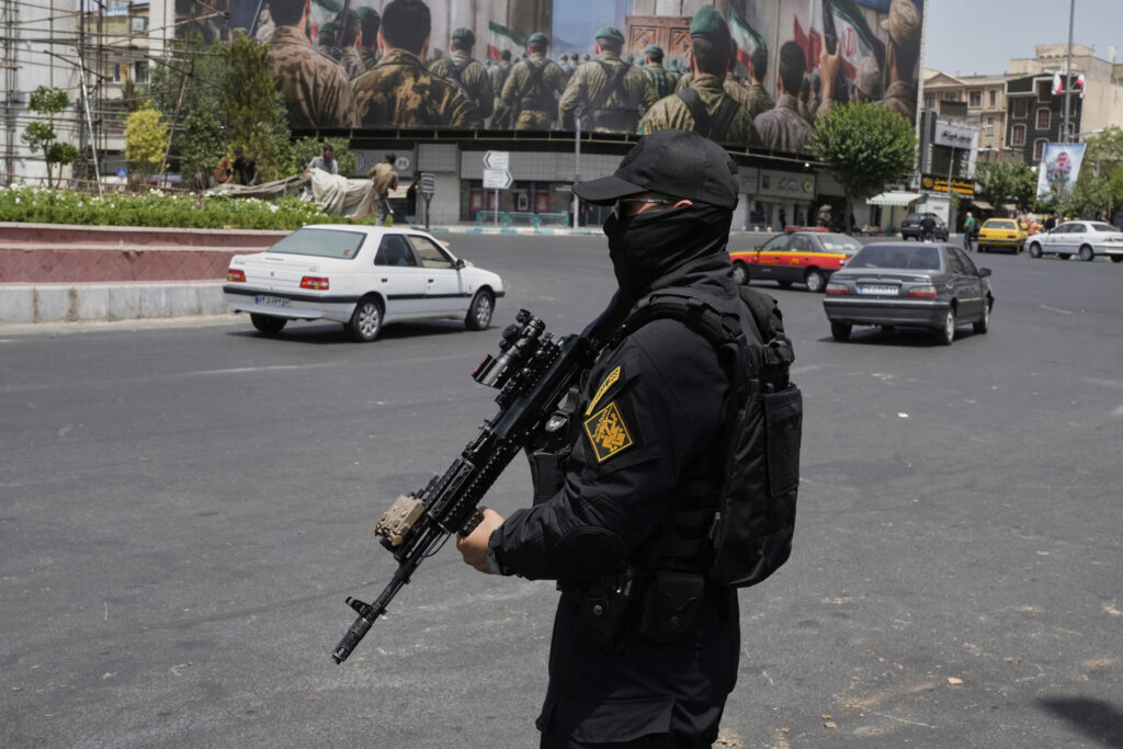 A member of Iran's Revolutionary Guard stands guard at Enqelab-e-Eslami (Islamic Revolution) square in downtown Tehran, Iran, on June 24, 2025.
