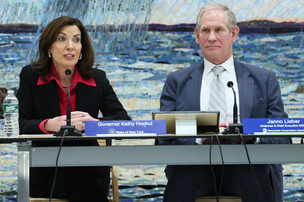 NEW YORK, NEW YORK - FEBRUARY 26: Gov. Kathy Hochul speaks as Janno Lieber, Chair & CEO at New York Metropolitan Transportation Authority, listens on during the MTA Board's monthly meeting at Grand Central Madison on February 26, 2025 in New York City. Gov. Kathy Hochul made remarks at the MTA monthly meeting where she spoke about the state's ongoing effort to continue its plan for congestion pricing. The board also heard public remarks from workers and people in the community. (Photo by