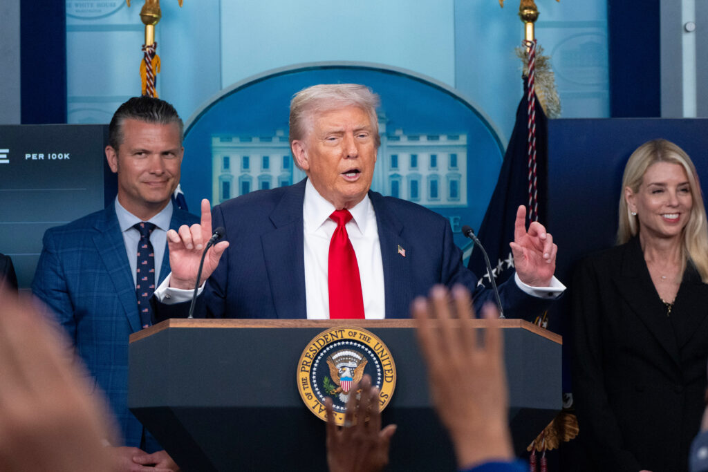 President Donald Trump speaks with reporters in the James Brady Press Briefing Room at the White House, Monday, Aug. 11, 2025, in Washington, as Secretary of Defense Pete Hegseth and Attorney General Pam Bondi look on. (AP Photo/Alex Brandon)