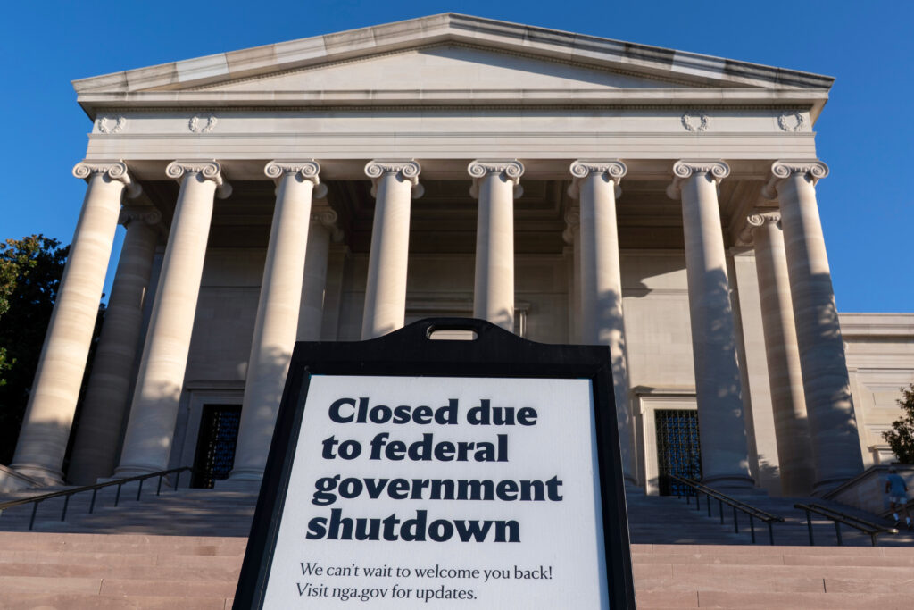 FILE - A sign that reads "Closed due to federal government shutdown," is seen outside of the National Gallery of Art on the 6th day of the government shutdown, in Washington, Oct. 6, 2025. (AP Photo/Jose Luis Magana, File)