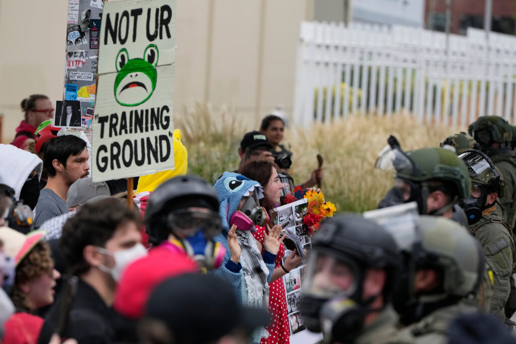Demonstrators standoff against Immigration and Customs Enforcement agents outside an ICE facility on Saturday, Oct. 4, 2025, in Portland, Ore.