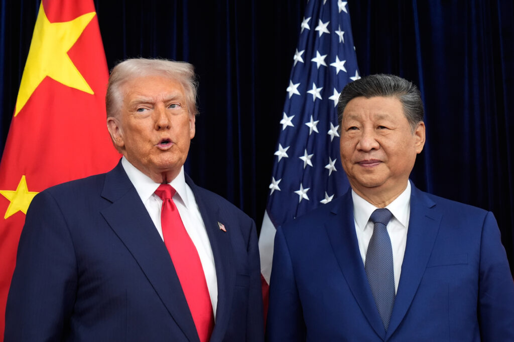 President Donald Trump, left, and Chinese President Xi Jinping pose together ahead of their summit talk at Gimhae International Airport in Busan, South Korea, Thursday, Oct. 30, 2025.