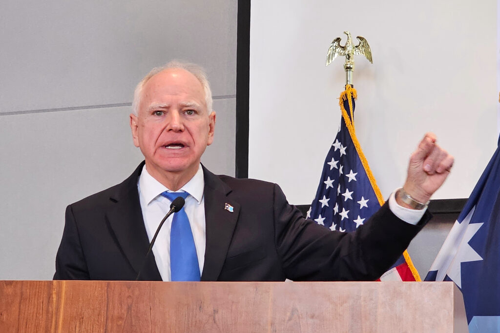 Democratic Gov. Tim Walz, speaking at a news conference on Thursday, Dec. 4, 2025, in St. Paul, denounces President Donald Trump for calling Minnesota's Somali community "garbage" and dismissing the state as a "hellhole." (AP Photo/Steve Karnowski)