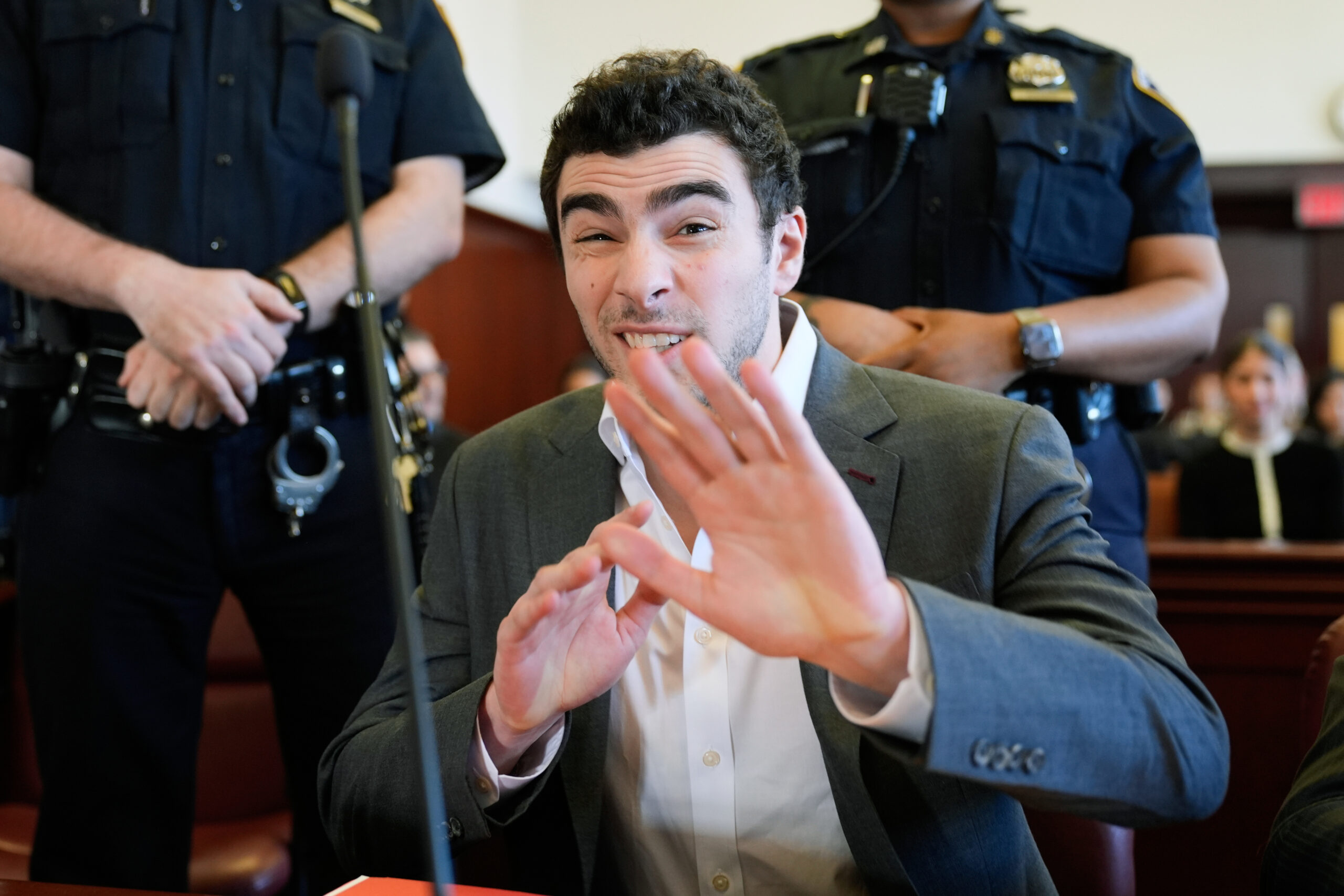 Luigi Mangione Beams and Gestures for the Cameras as Fan Group Says He ...