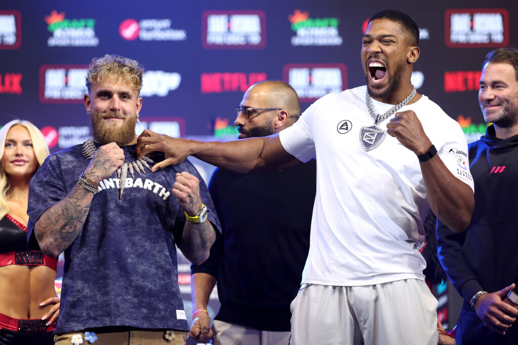 MIAMI BEACH, FLORIDA - DECEMBER 17: (L-R) Jake Paul and Anthony Joshua face off during the press conference for Jake Paul v Anthony Joshua at The Fillmore Miami Beach on December 17, 2025 in Miami Beach, Florida. (Photo by Megan Briggs/Getty Images for Netflix)