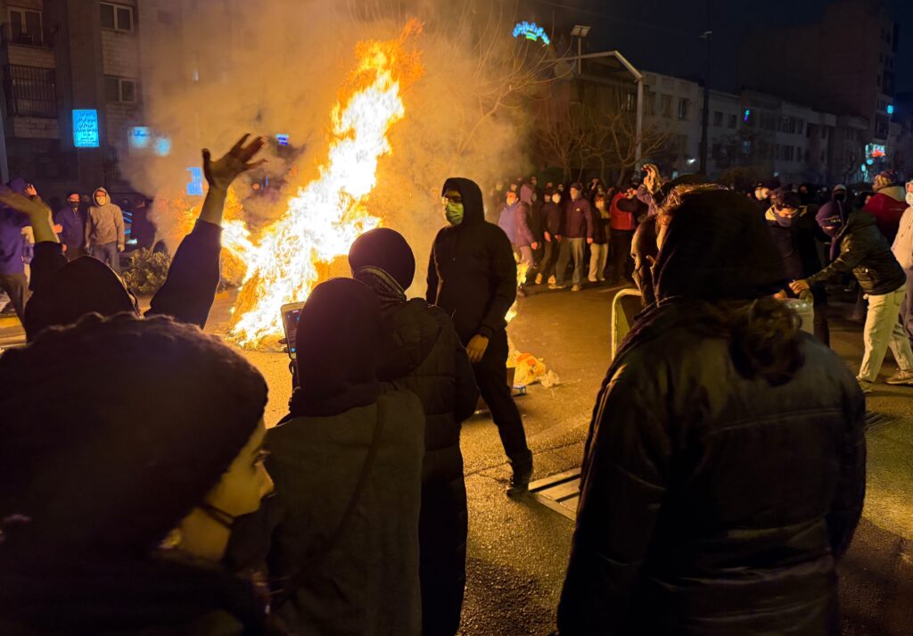 Iranians attend an anti-government protest in Tehran, Iran, Friday, Jan. 9, 2026.
